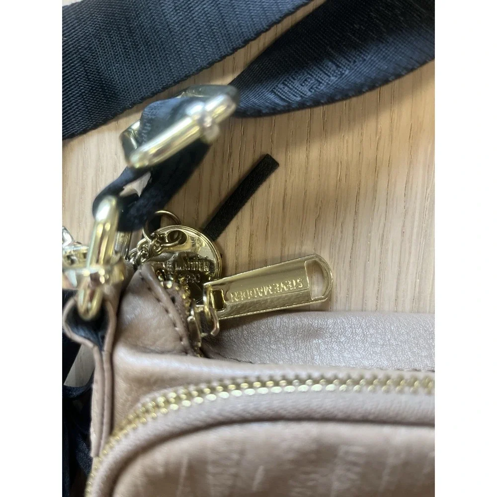 Steve Madden Taupe Embossed Logo Crossbody Bag Tassel Black Strap Gold Hardware